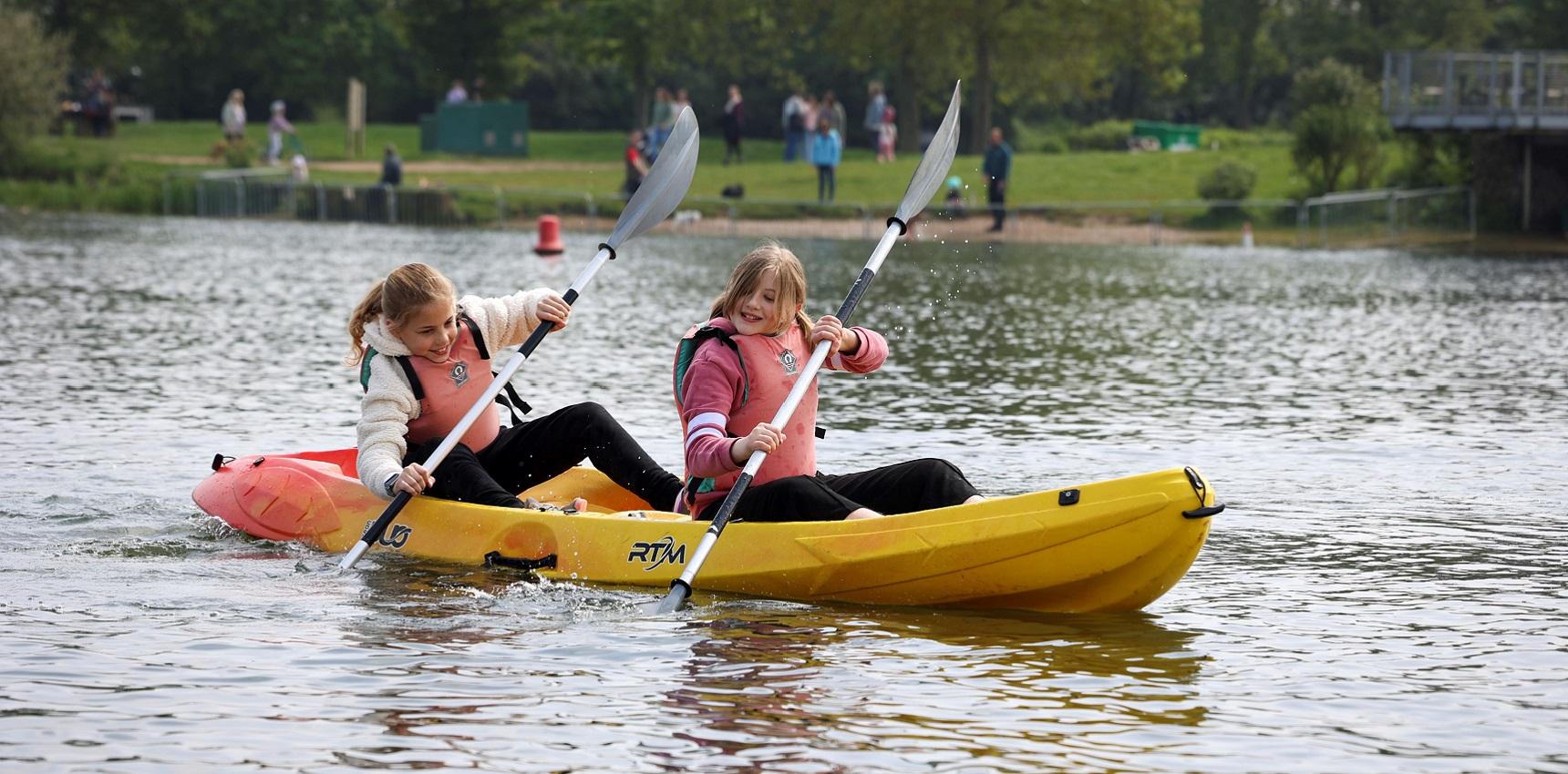 two children canoeing