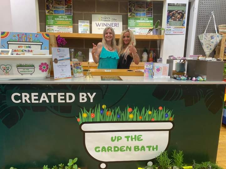 Retailers behind the 'Up The Garden Bath' pop-up shop counter