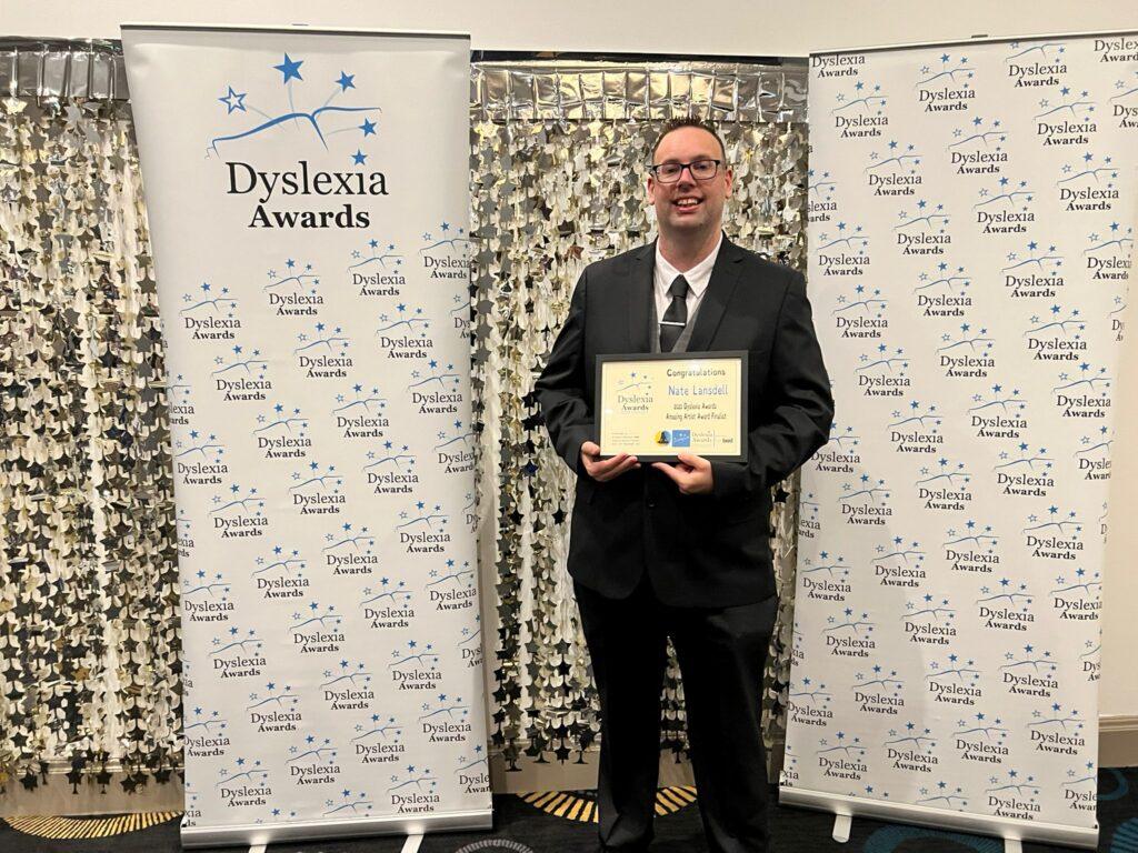 Nate Lansdsell shows his award at the Dyslexia Awards 2023