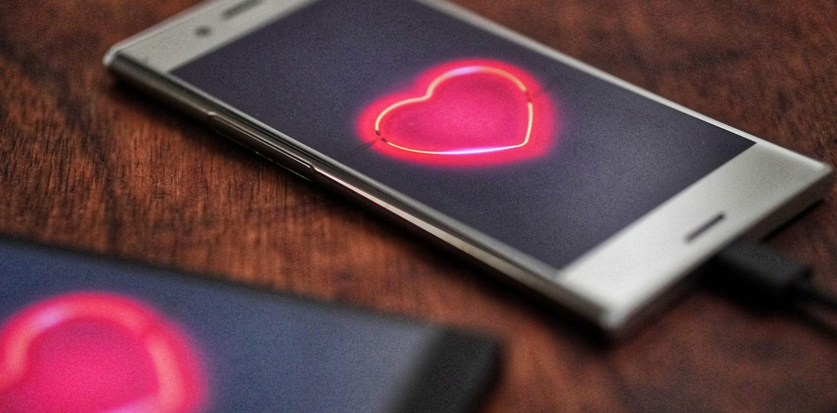 Mobile phone showing a heart icon